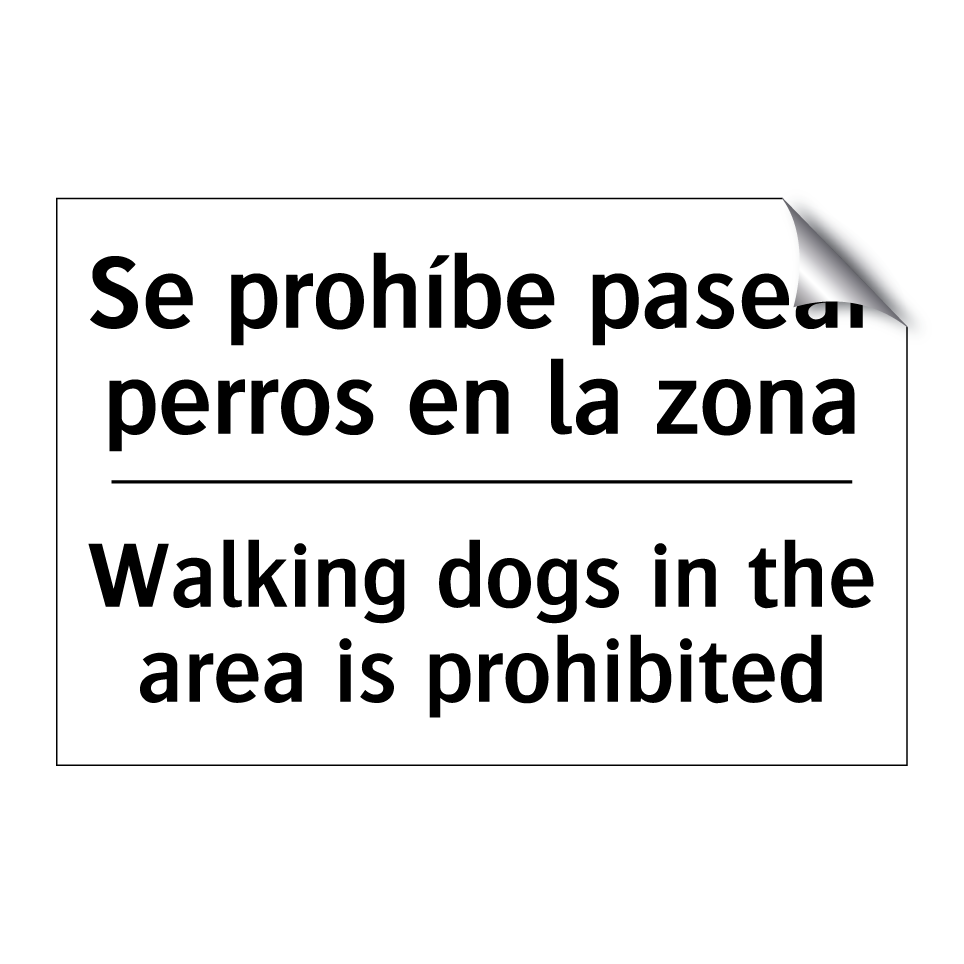 Se prohíbe pasear perros en la zona - Walking dogs in the area is prohibited