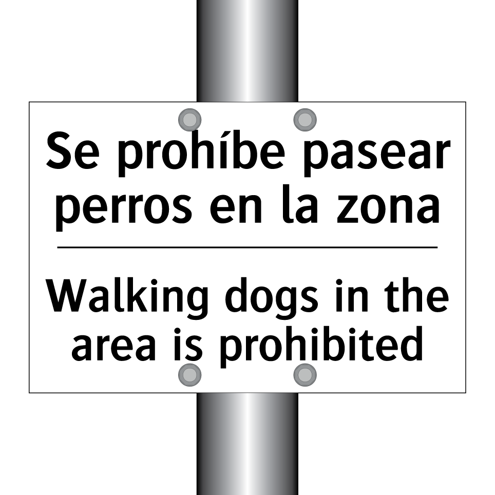 Se prohíbe pasear perros en la zona - Walking dogs in the area is prohibited